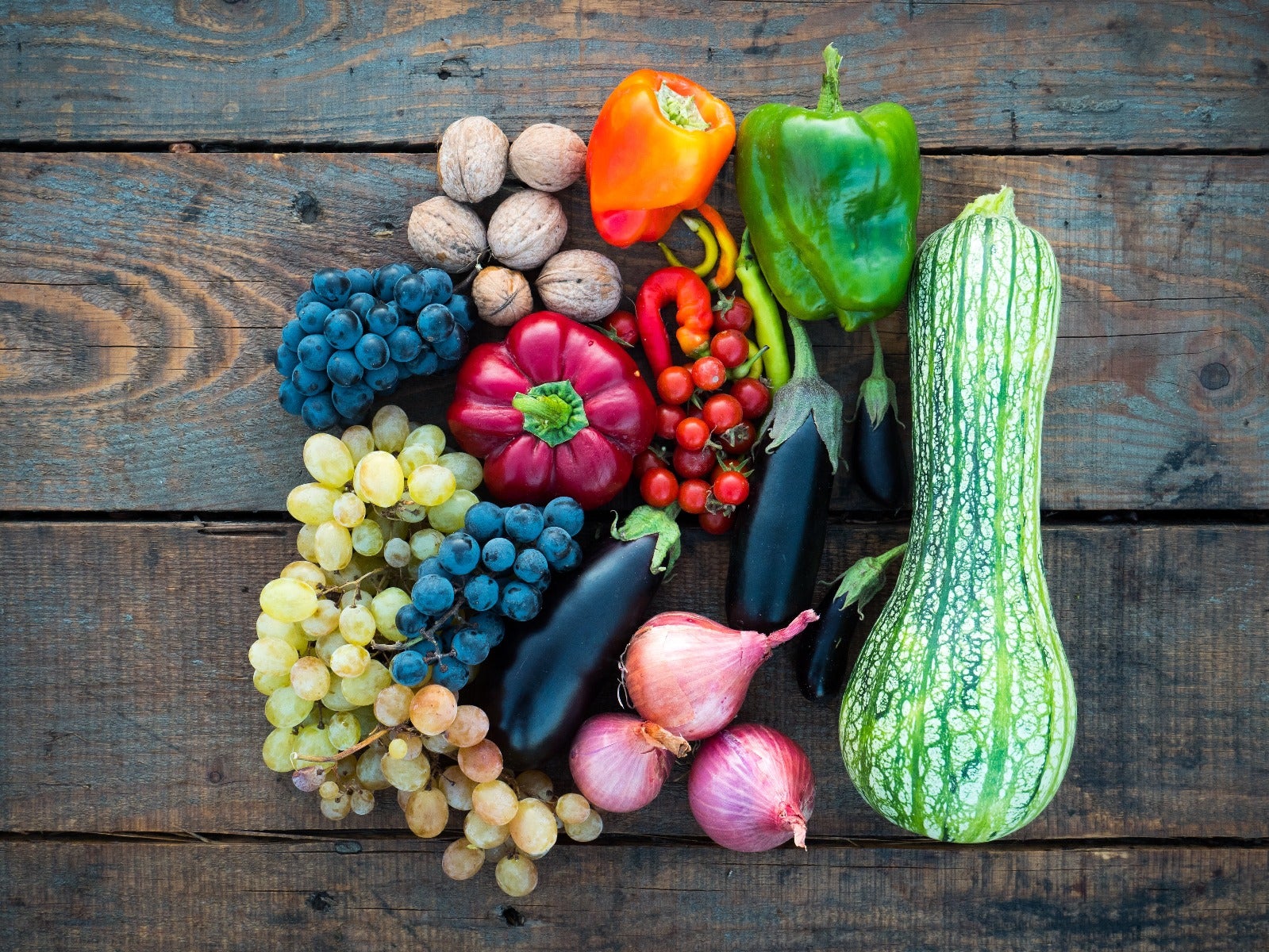 assorted fruits and vegetables on wood table